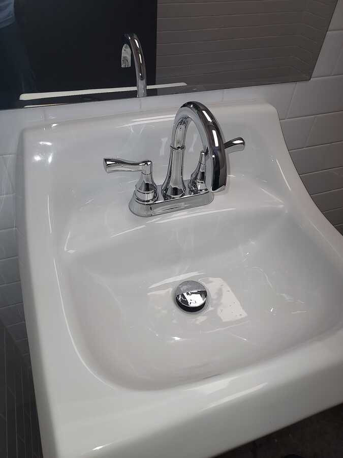 Bathroom faucet and basin in a photo posted by Jeremy