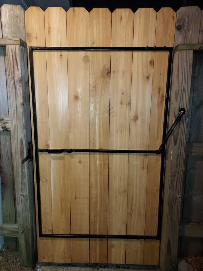 Wooden fence gate with metal hardware, shared by Jeremy